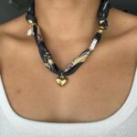 scarf necklace with charm - featured image